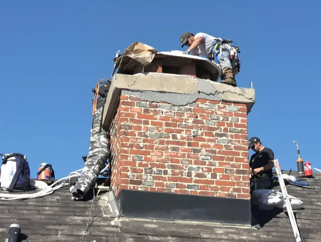 Fairhaven Chimney Sweep installing a custom chimney crown in Fairhaven, MA