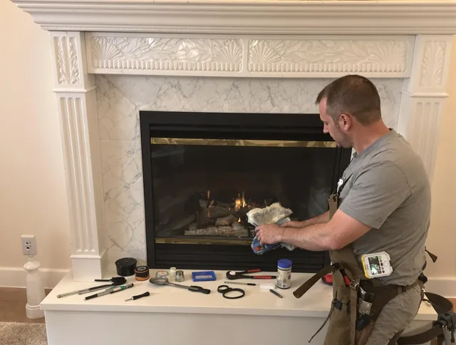 Fairhaven Chimney Sweep performing fireplace maintenance in Fairhaven, MA