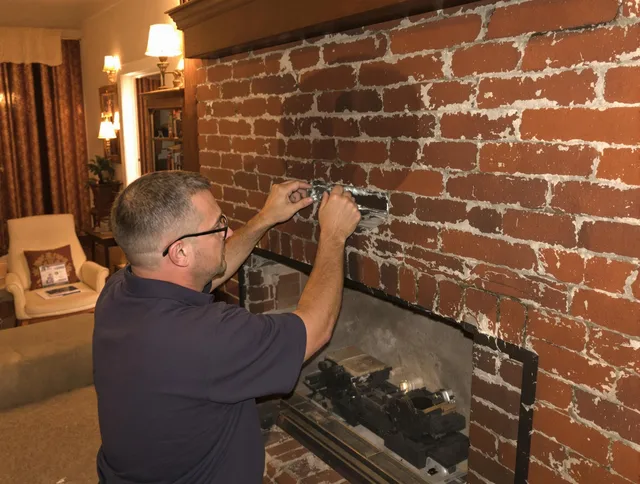 Fairhaven Chimney Sweep expert fixing a fireplace in Fairhaven, MA